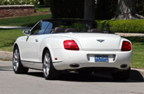 A three-quarter rear view of a white 2007 Bentley Continental GTC A three-quarter rear view of a white 2007 Bentley Continental GTC
